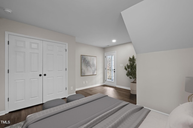 bedroom featuring dark hardwood / wood-style floors and a closet