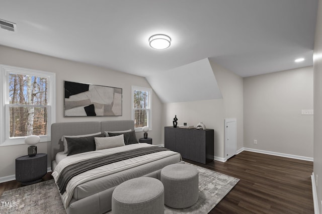 bedroom with dark hardwood / wood-style flooring and vaulted ceiling