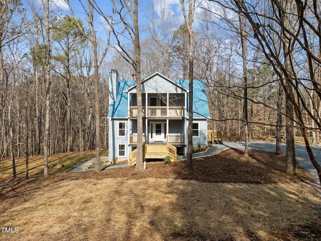 view of front facade with a porch and a balcony