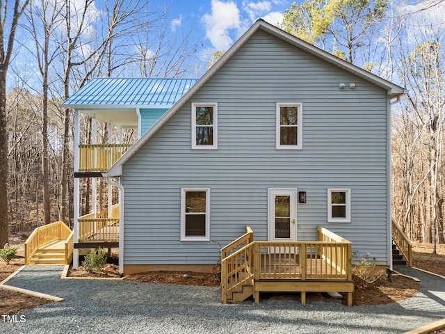 rear view of property with a deck