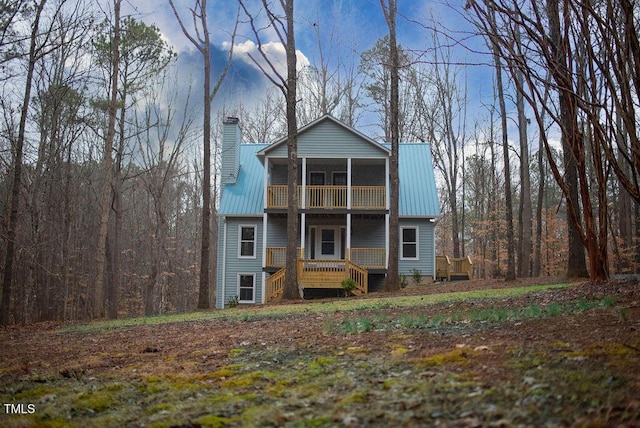 view of front of home with a sunroom