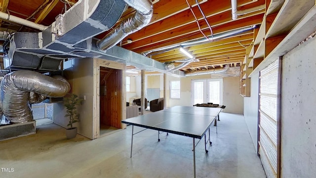 recreation room with concrete flooring