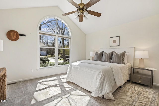 bedroom featuring baseboards, multiple windows, high vaulted ceiling, and carpet flooring