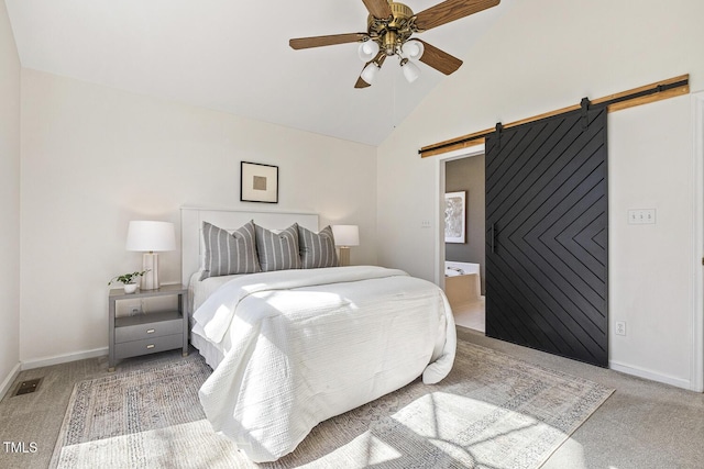 bedroom featuring baseboards, visible vents, carpet floors, lofted ceiling, and a barn door