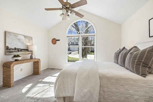 bedroom with vaulted ceiling, carpet flooring, a ceiling fan, and baseboards