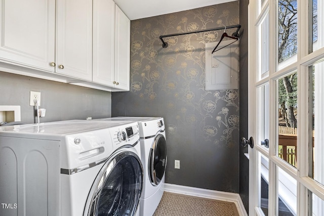 laundry area with wallpapered walls, baseboards, cabinet space, and washing machine and clothes dryer