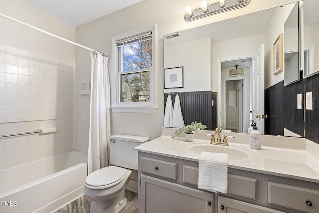 full bathroom featuring visible vents, shower / bathtub combination with curtain, toilet, and vanity