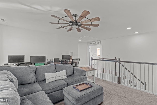 carpeted living room featuring ceiling fan