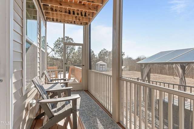 sunroom / solarium featuring a healthy amount of sunlight