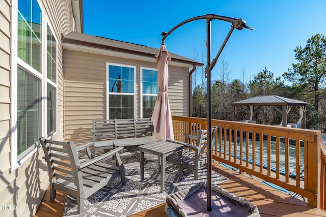 wooden deck featuring a gazebo