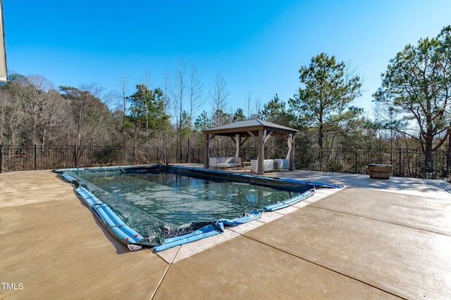 view of swimming pool with a gazebo and a patio area