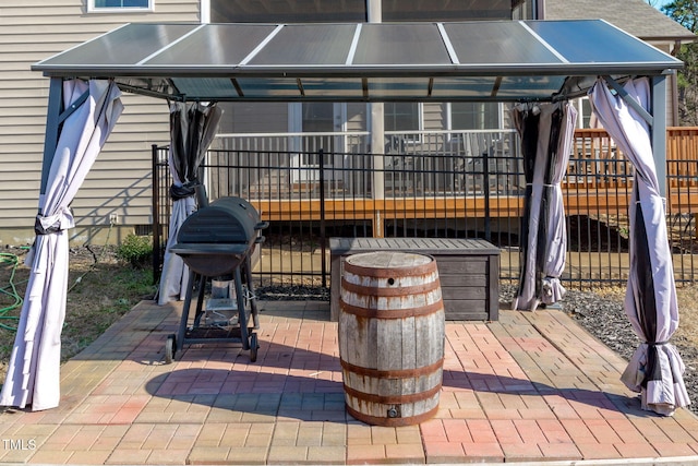 view of patio / terrace with a gazebo, area for grilling, and an outdoor fire pit