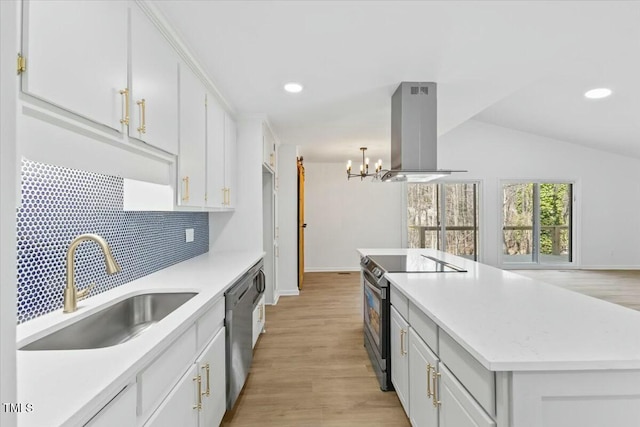 kitchen with sink, stainless steel appliances, white cabinets, and island exhaust hood