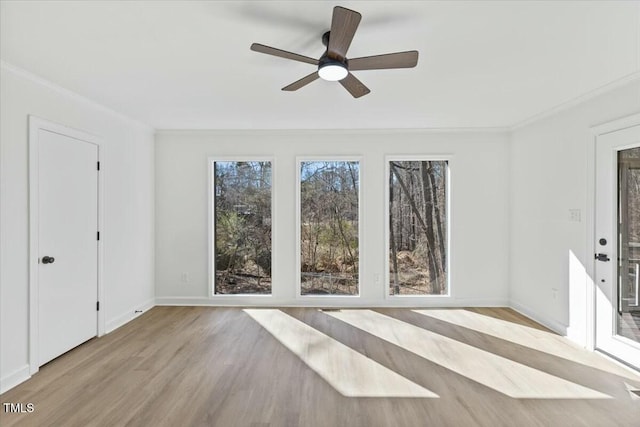 interior space with ceiling fan