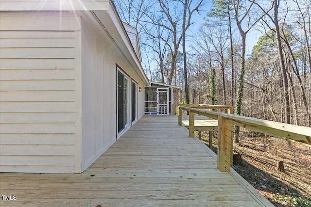 wooden terrace with a sunroom