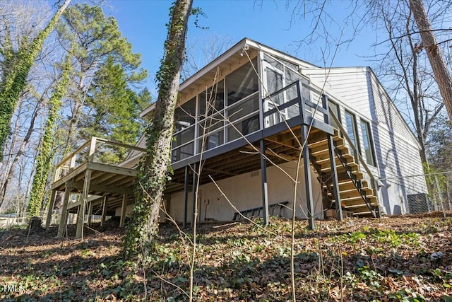 back of property featuring a sunroom