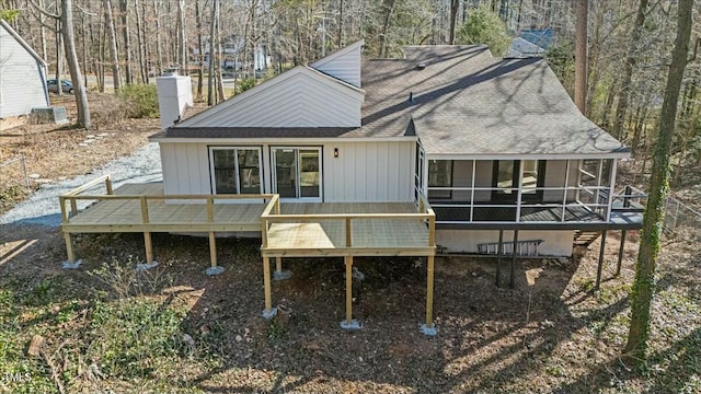 back of house with a deck and a sunroom