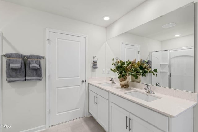 bathroom with vanity and an enclosed shower