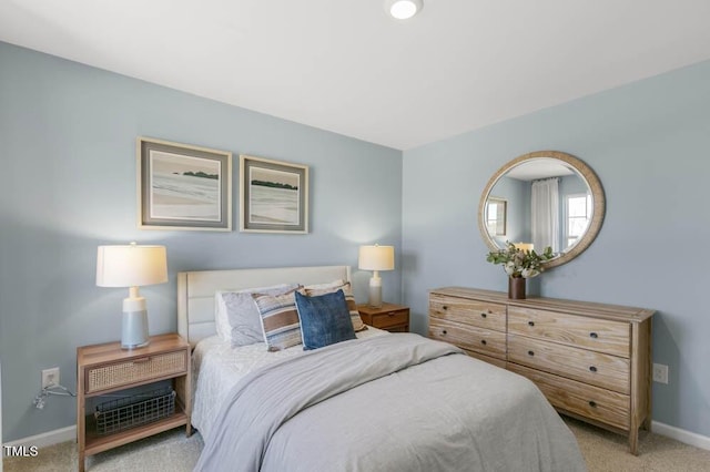 bedroom featuring light colored carpet