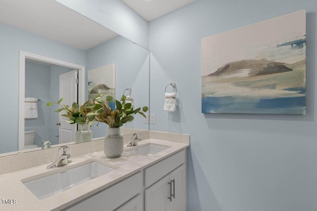 bathroom with vanity and toilet