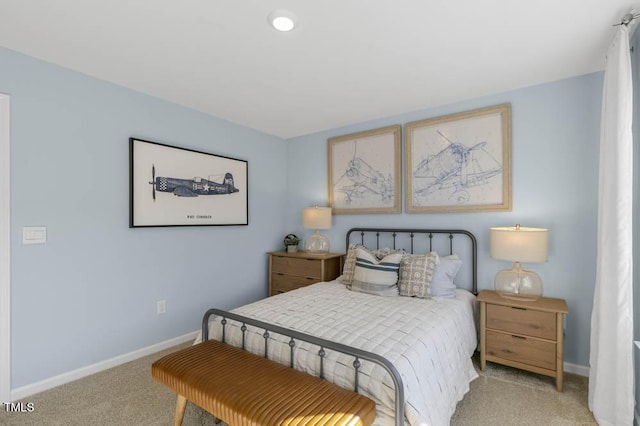 bedroom featuring light colored carpet