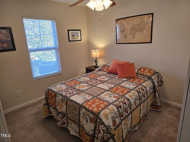 bedroom featuring dark colored carpet and ceiling fan