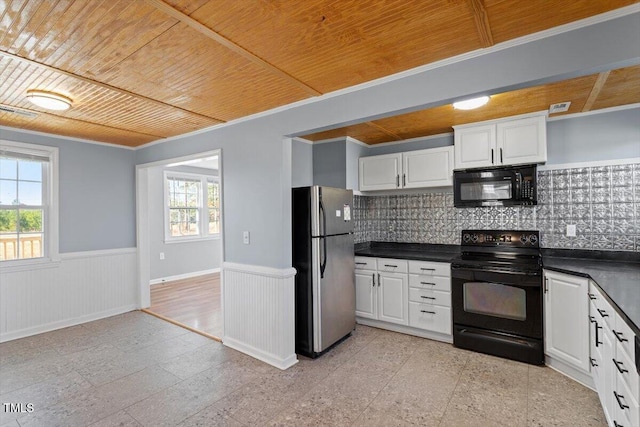 kitchen featuring a healthy amount of sunlight, white cabinets, wood ceiling, and black appliances