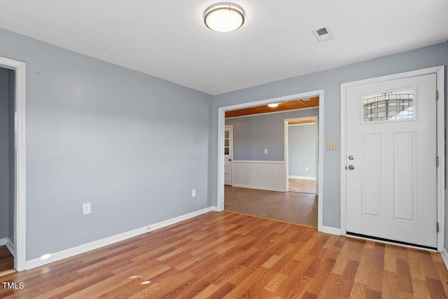 foyer entrance with light hardwood / wood-style flooring