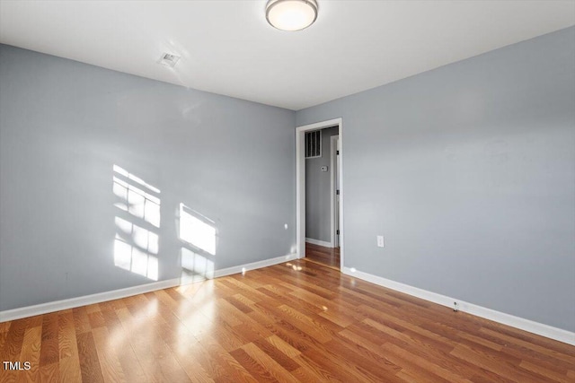 unfurnished room featuring light hardwood / wood-style floors