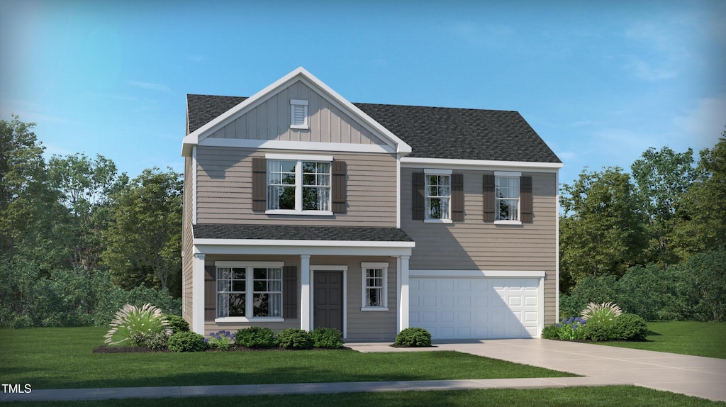 view of front of house with a garage and a front lawn