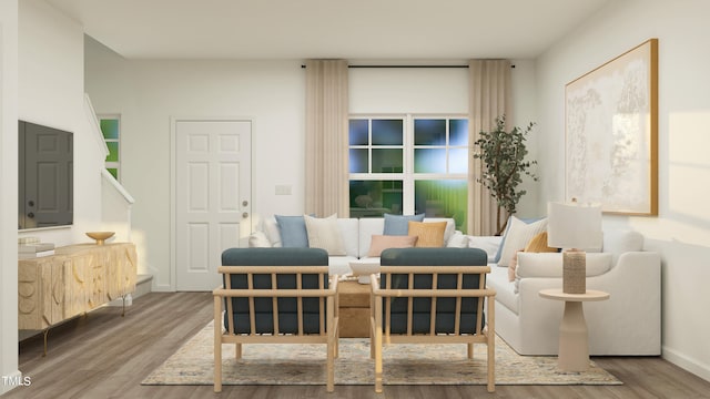 sitting room with wood-type flooring