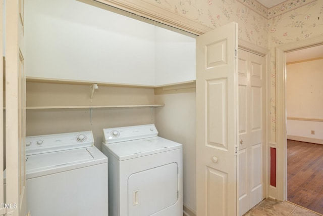 clothes washing area with washer and dryer