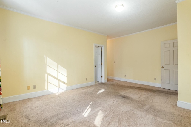 carpeted spare room with crown molding