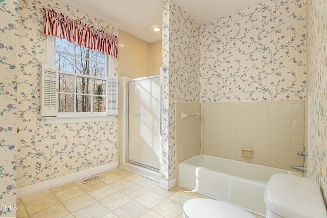 bathroom featuring tile patterned floors, toilet, and plus walk in shower