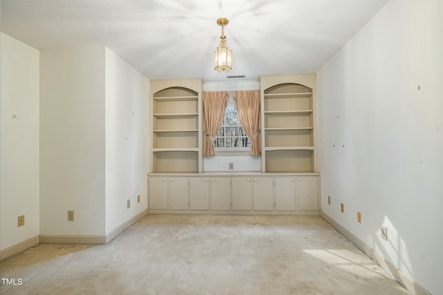 empty room with light colored carpet