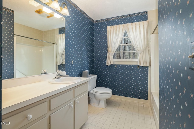 full bathroom with tile patterned flooring, vanity, bathing tub / shower combination, and toilet