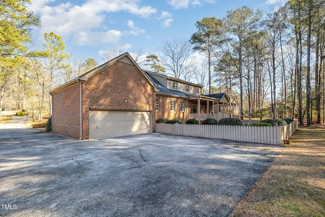 view of front facade featuring a garage and covered porch