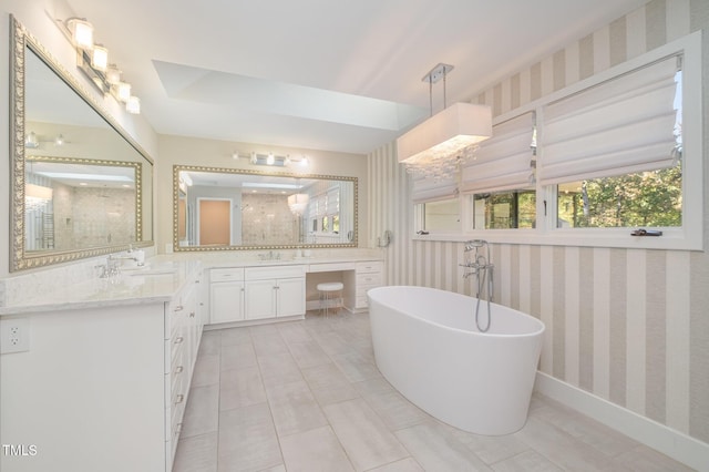 bathroom featuring vanity and a bathing tub