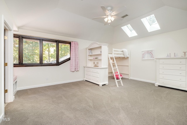 unfurnished bedroom with vaulted ceiling, carpet floors, and ceiling fan