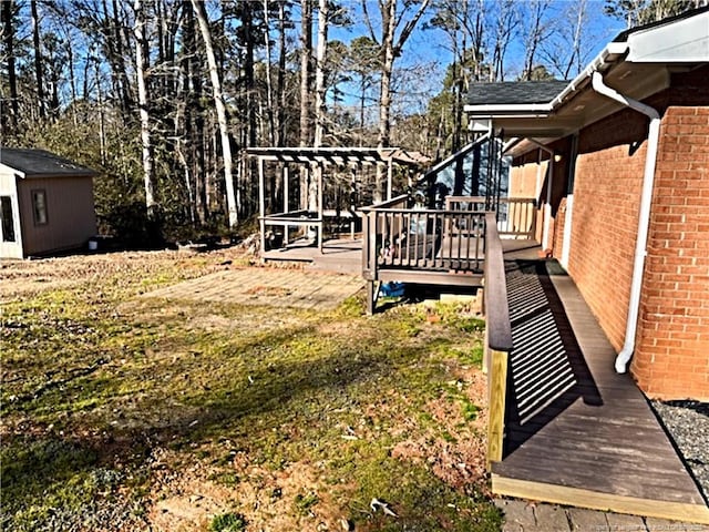 view of yard with a deck and a shed