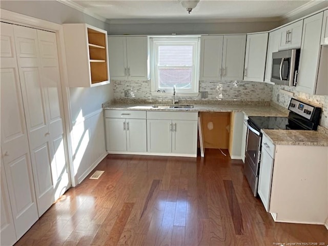 kitchen with white cabinetry, sink, backsplash, dark hardwood / wood-style flooring, and stainless steel appliances