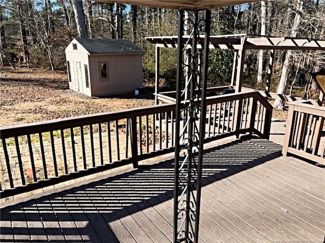 deck featuring a storage unit and a pergola