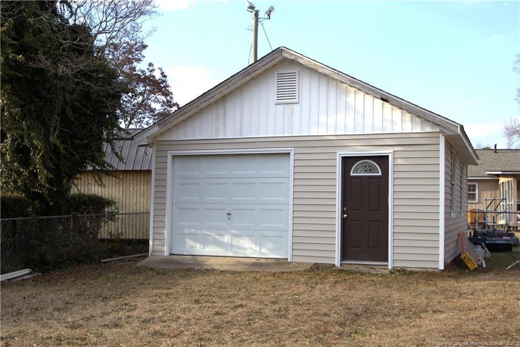 garage with a yard