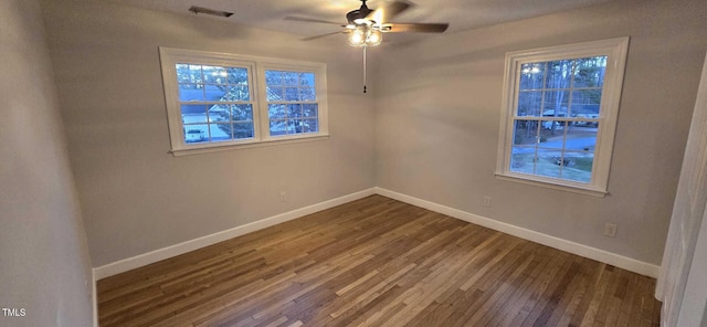 unfurnished room with wood-type flooring and ceiling fan