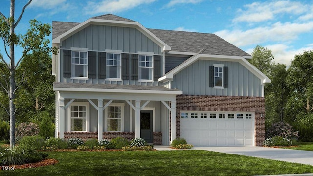 view of front facade with a garage and a front yard