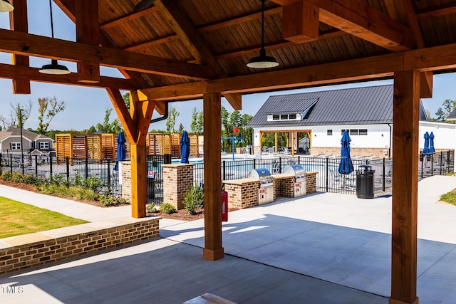 view of patio / terrace featuring a gazebo and exterior kitchen