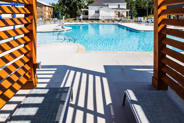 view of swimming pool with a patio