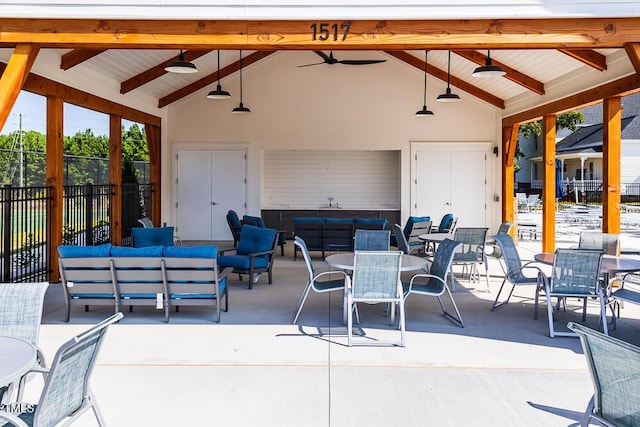 view of patio with ceiling fan and an outdoor living space