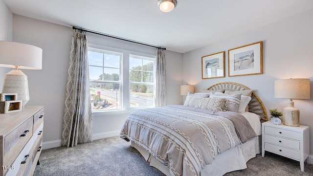 bedroom featuring dark carpet