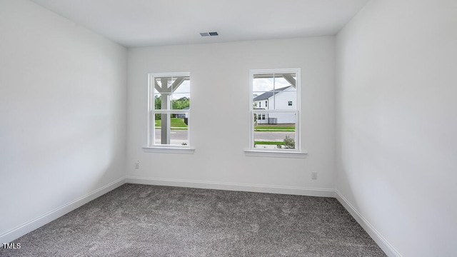 1705 Clydner Dr, Cary, NC 27523 - spare room featuring dark carpet and baseboards